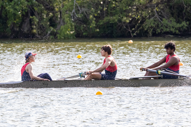 Boy's four person shell in a race