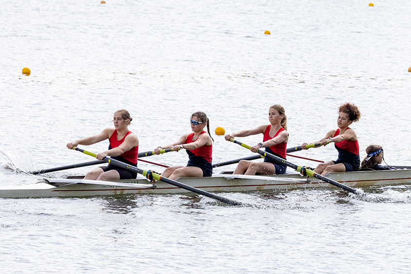 Girl's four person shell in a race