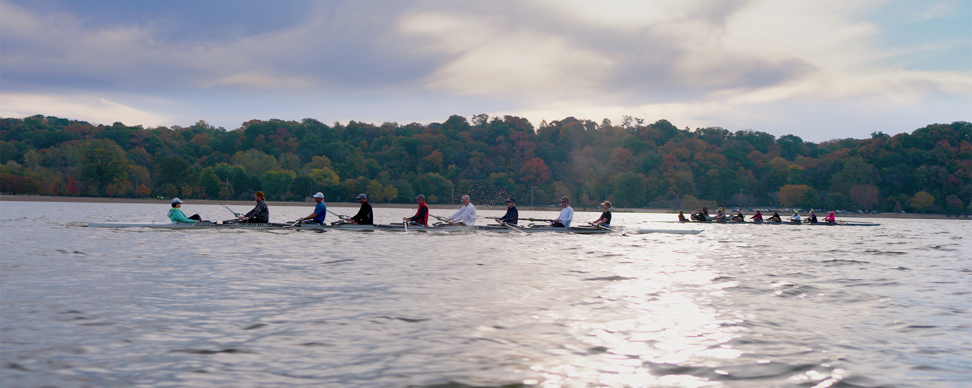 Two eight person shells on the lake practicing