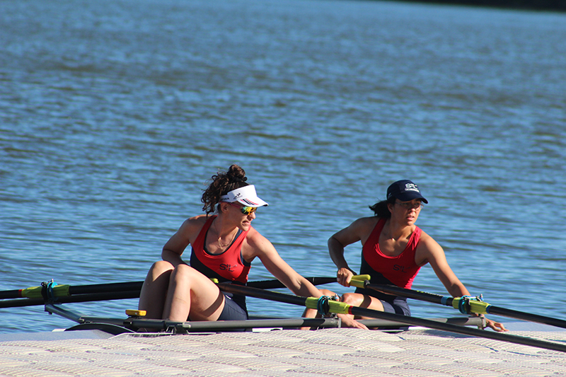 Pair women's scullers at dock