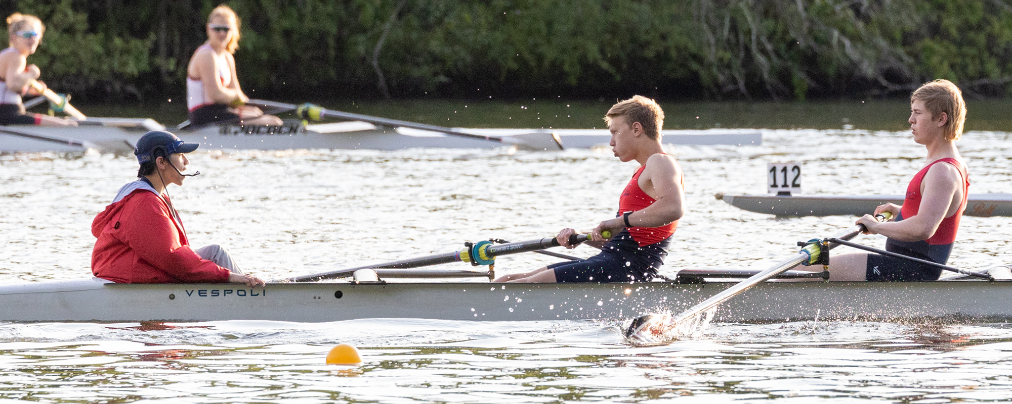 Novice girls rowing in a race