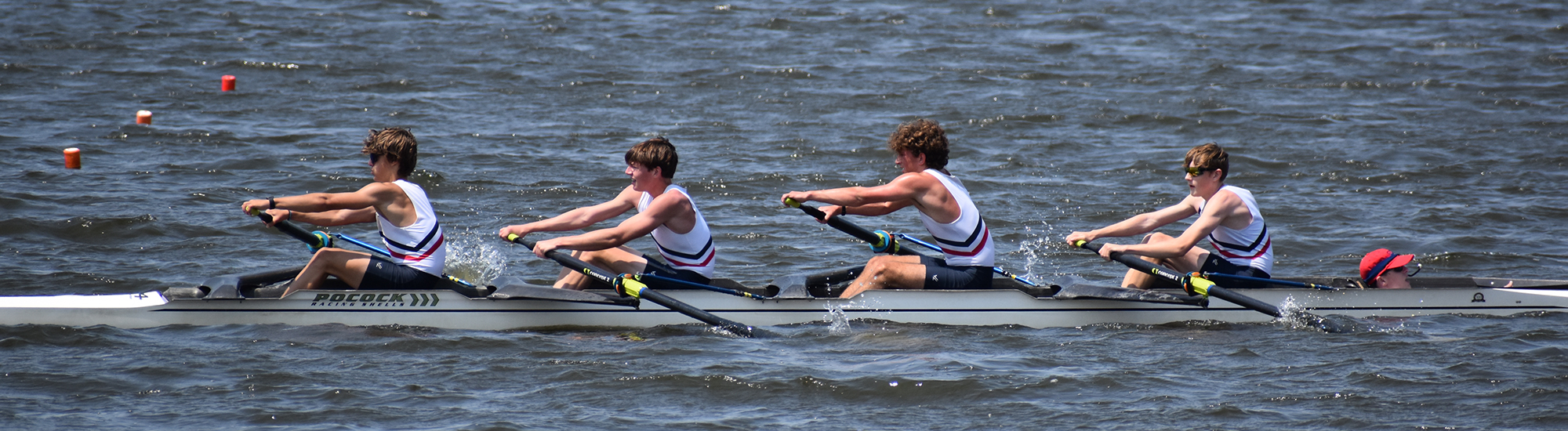 Junior boys rowing a 4 person shell